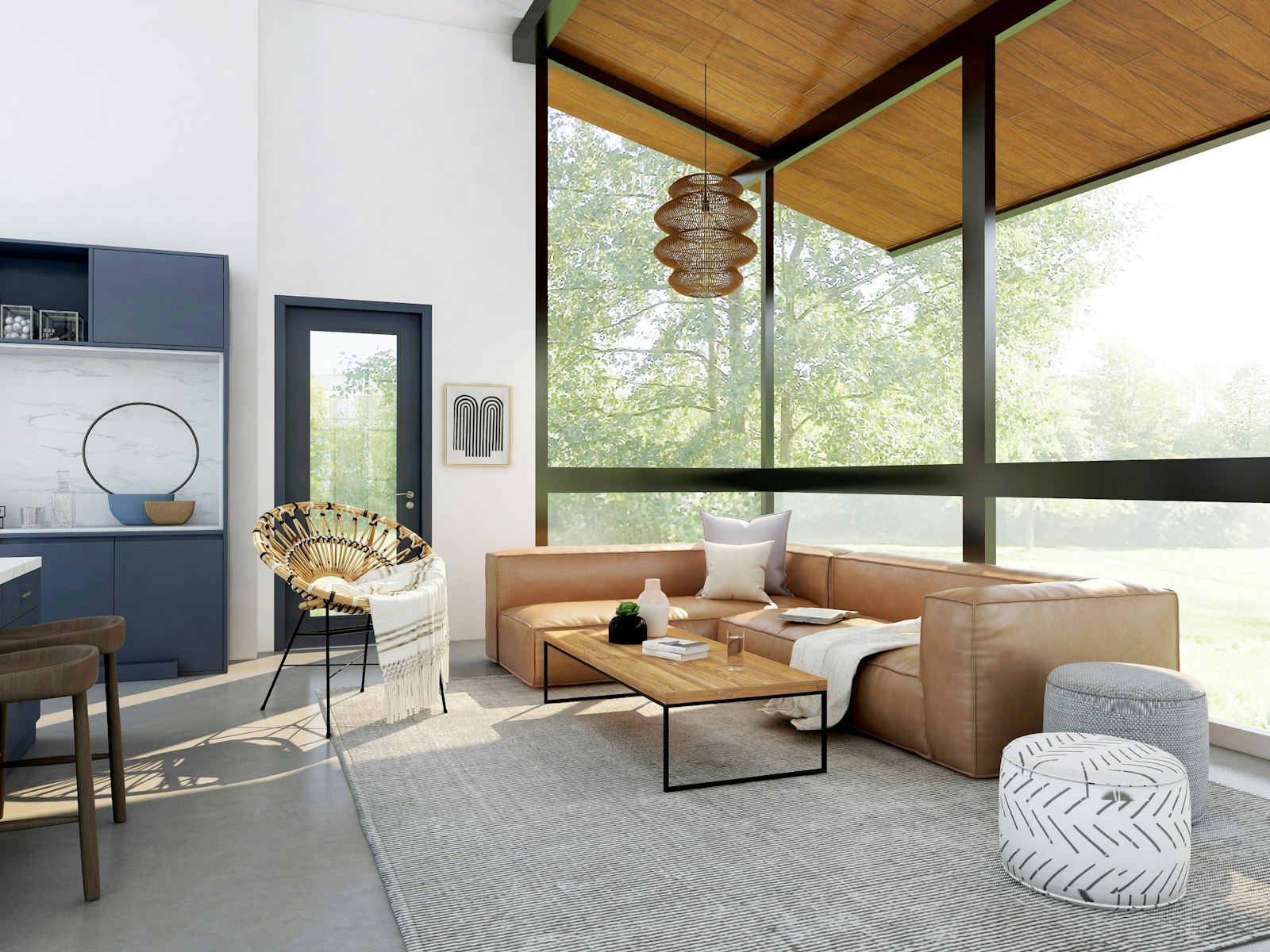 An open living room with a leather sectional and floor-to-ceiling windows